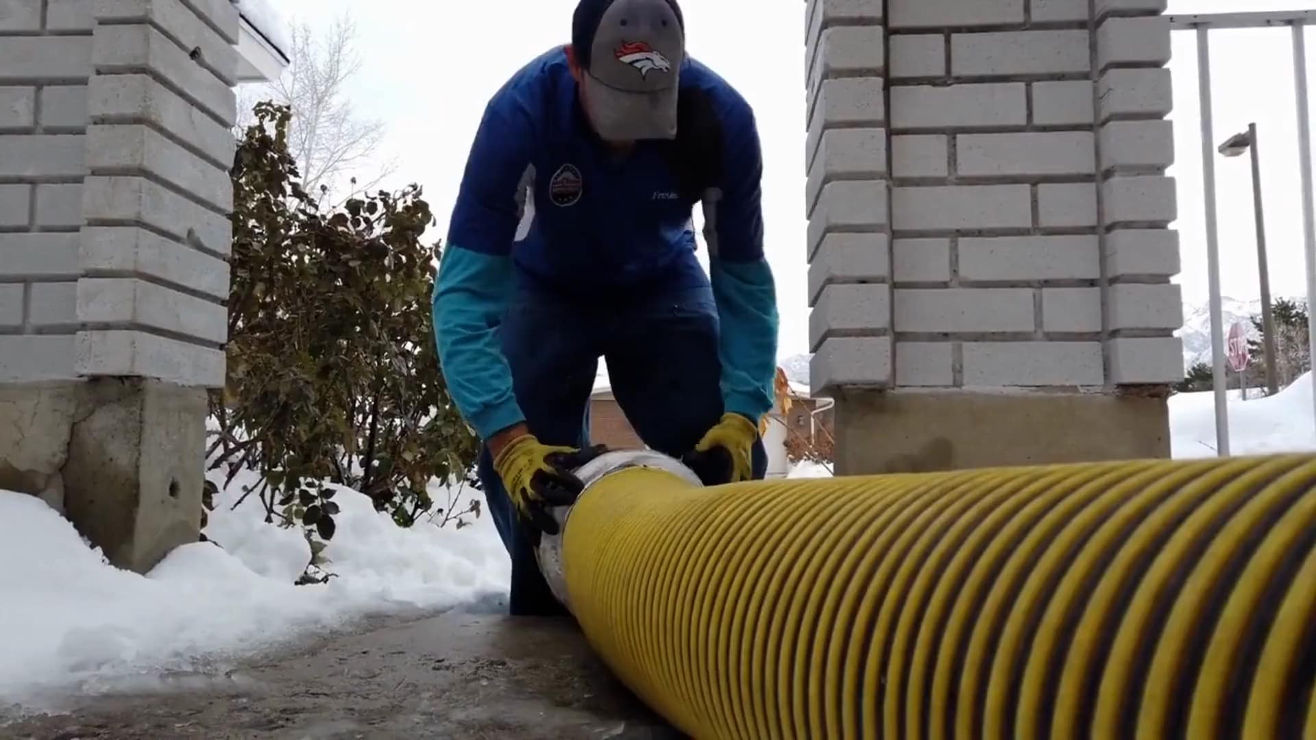 Fresh Ducts technician setting up truck-mounted negative-air equipment for duct cleaning