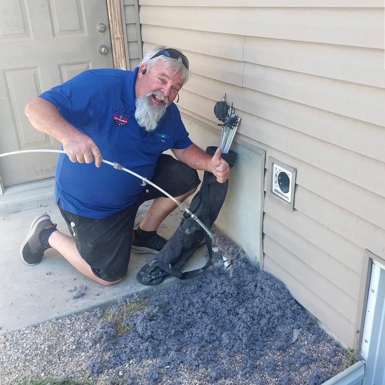 Fresh Ducts technician with lint removed during dryer vent cleaning