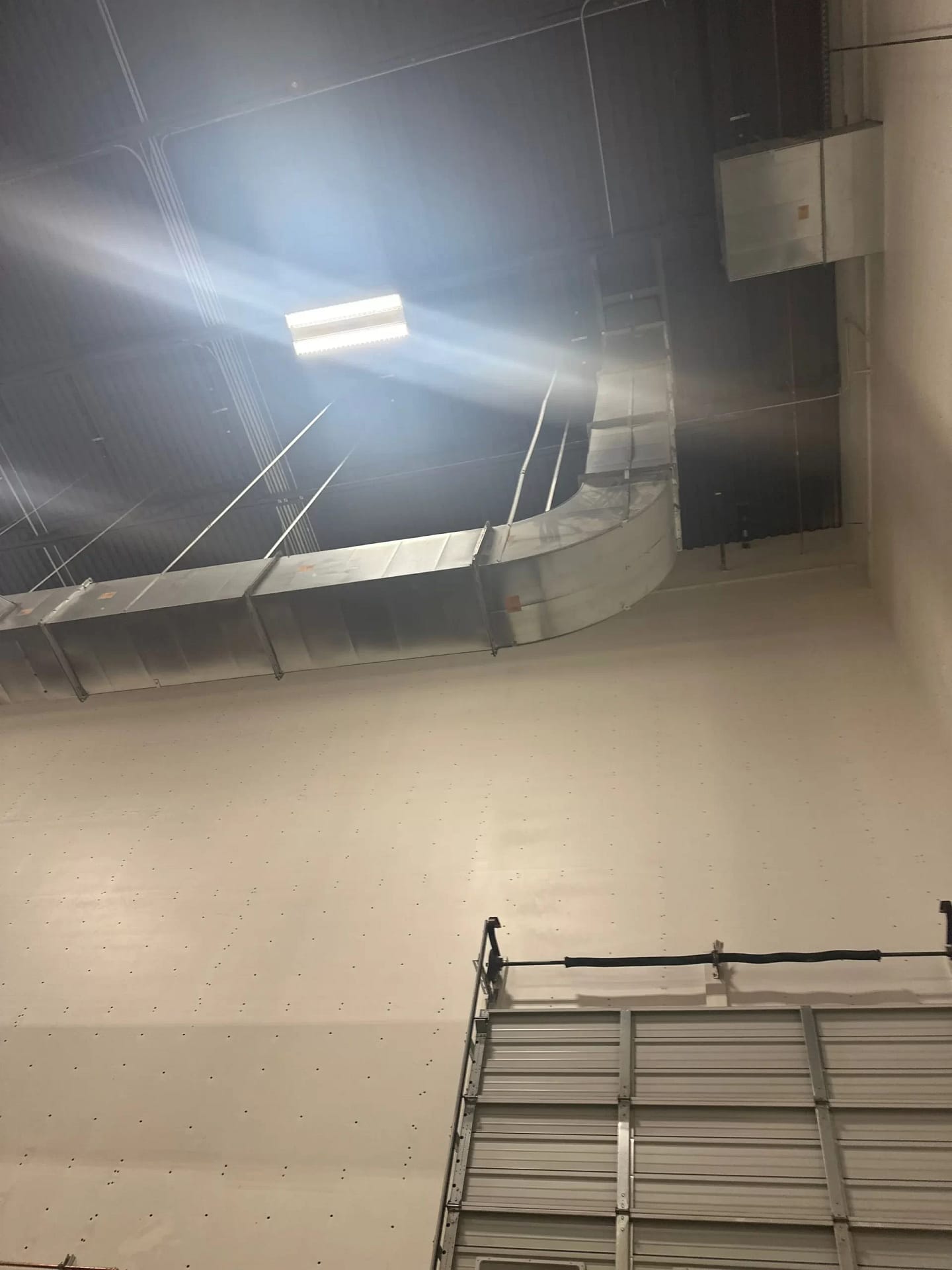 Commercial ductwork installed high above an occupied Utah workspace